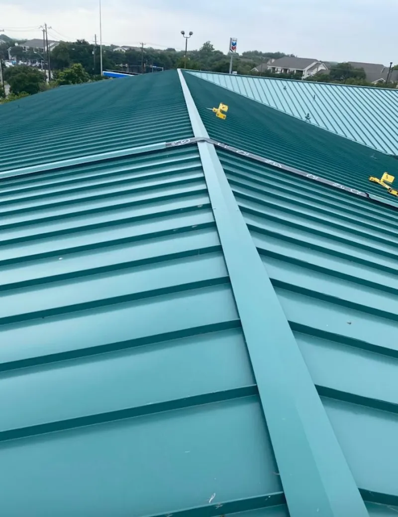 Green commercial metal roof ridge and valley for Metal Roof Repair in Columbine